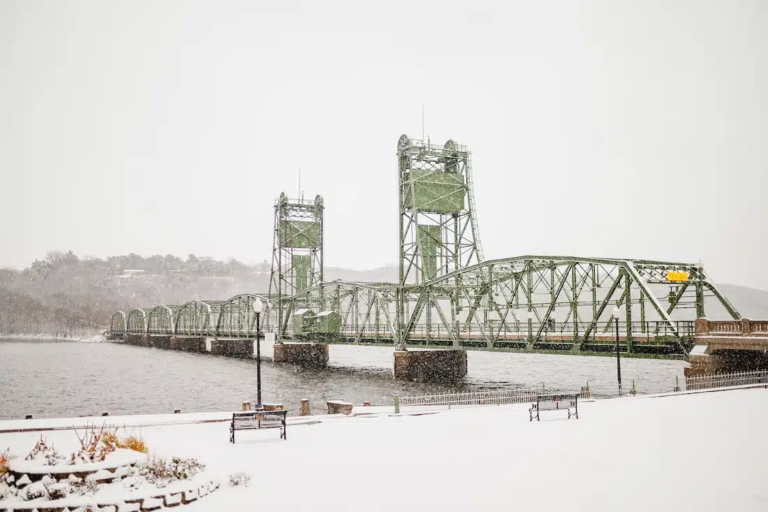 Things to do in Stillwater, shot of the historic lift bridge with snowfall and grey stormy clouds