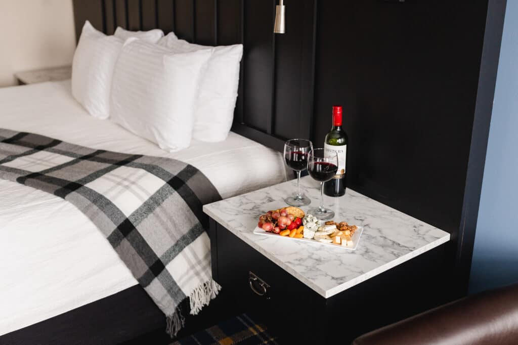a room and charcuterie board at our Stillwater Hotel.