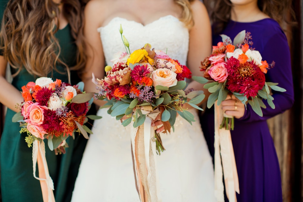 Bride and attendants holding flowers at one of the best wedding venues in Stillwater MN