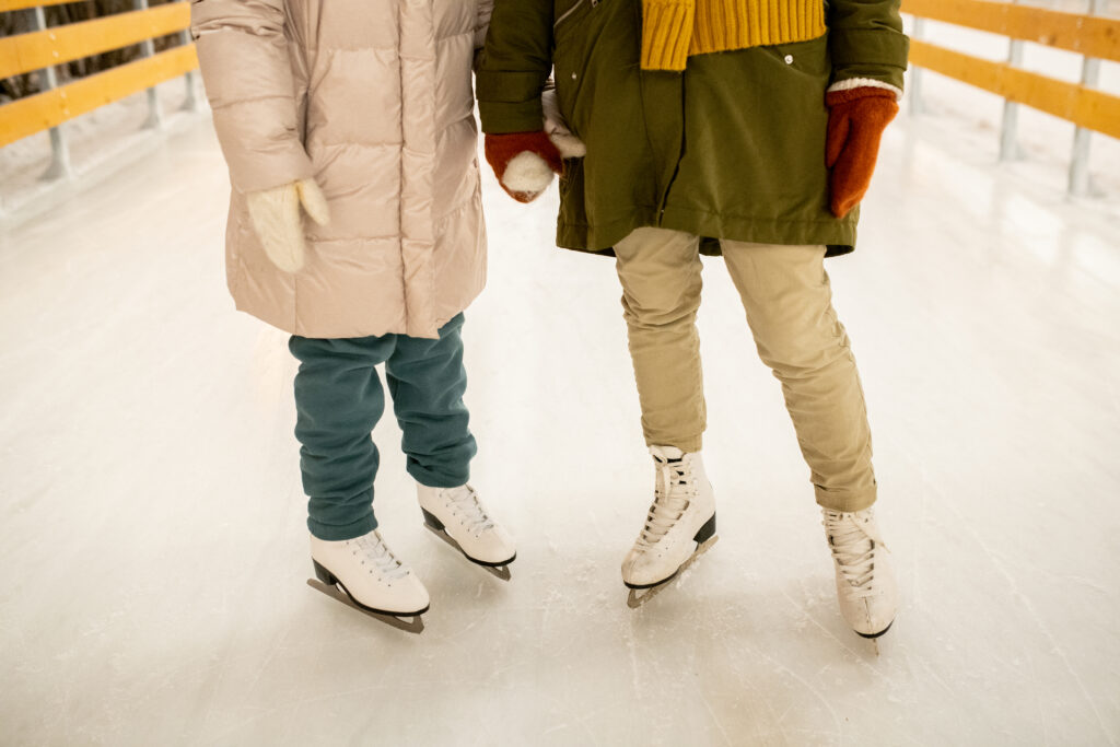 up close photo of couple on outdoor ice skating rink, one of the best things to do on a weekend trip from Minneapolis