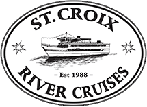 Logo for St. Croix River Cruises: an oval containing a riverboat, stars, and text reading "Est 1988" on black background.