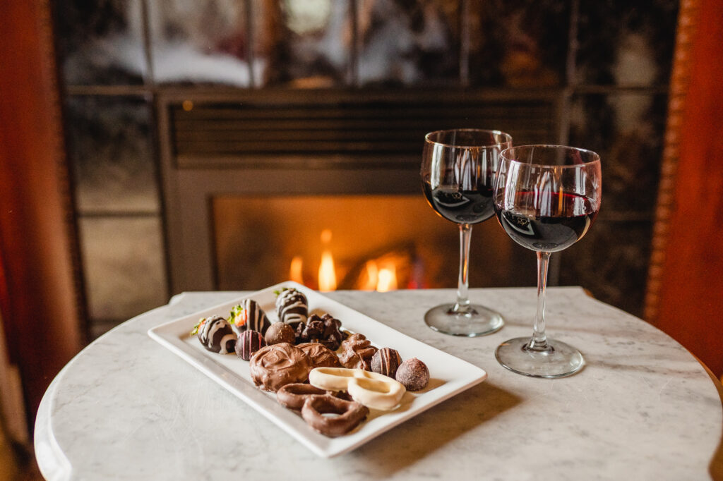 Victorian suite at Water Street Inn, with fireplace, glasses of wine and chocolates