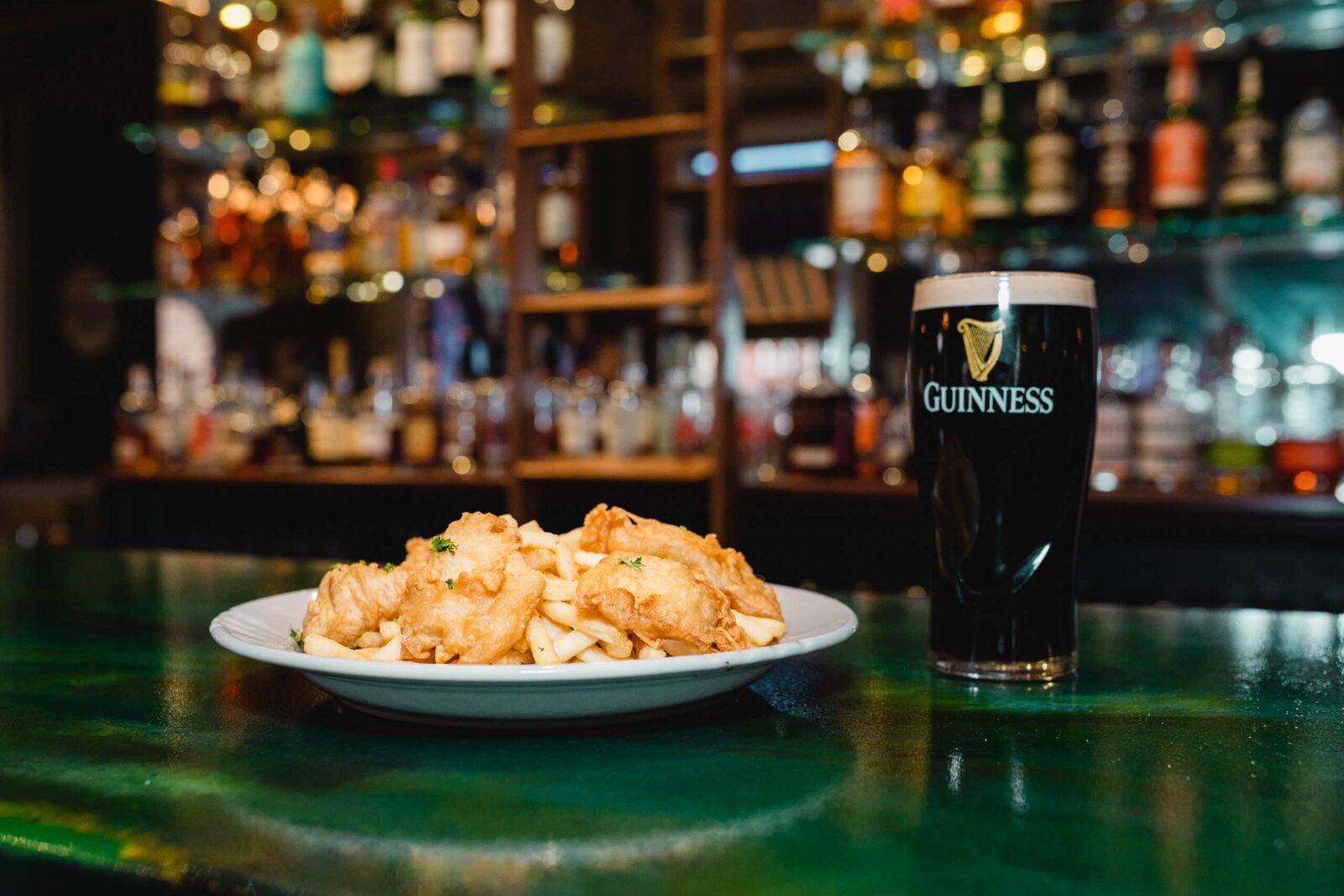 The Best Stillwater Restaurants for Date Night 1 Traditional Fish Fry and pint at Charlies, one of the best Stillwater Restaurants.