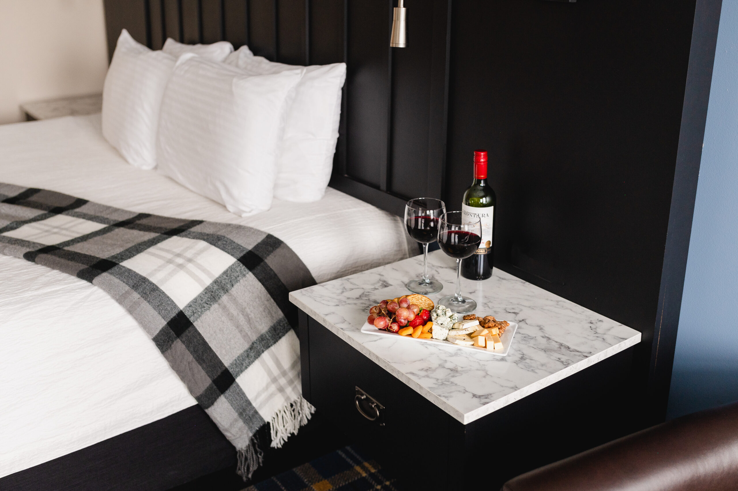 Unwind at the Best Winery in Stillwater MN 2 a room and charcuterie board at our Stillwater Hotel.